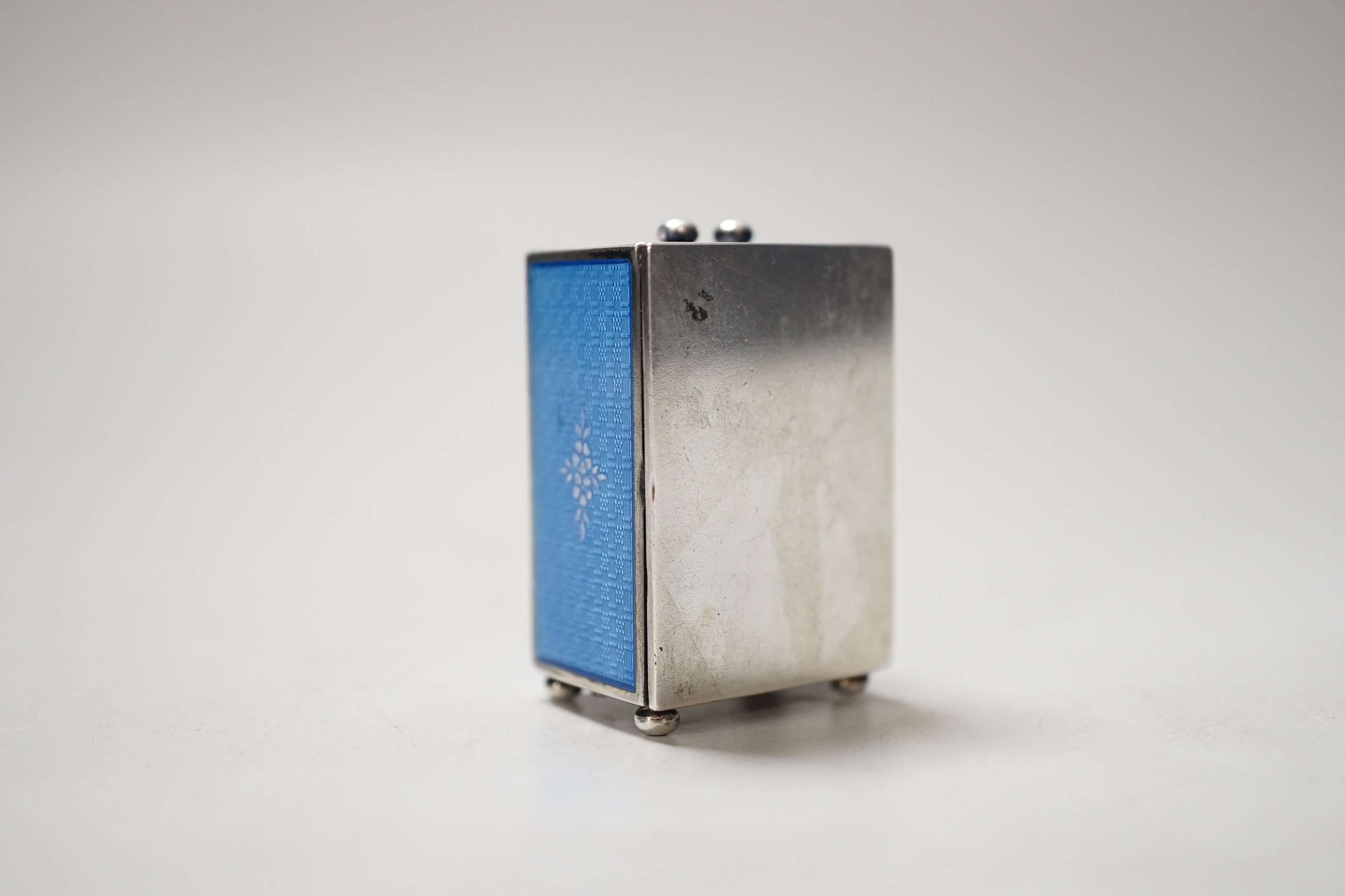 A 20th century Continental 935 standard blue enamelled white metal miniature timepiece, with mechanical movement, 4.5cm, lacks handle